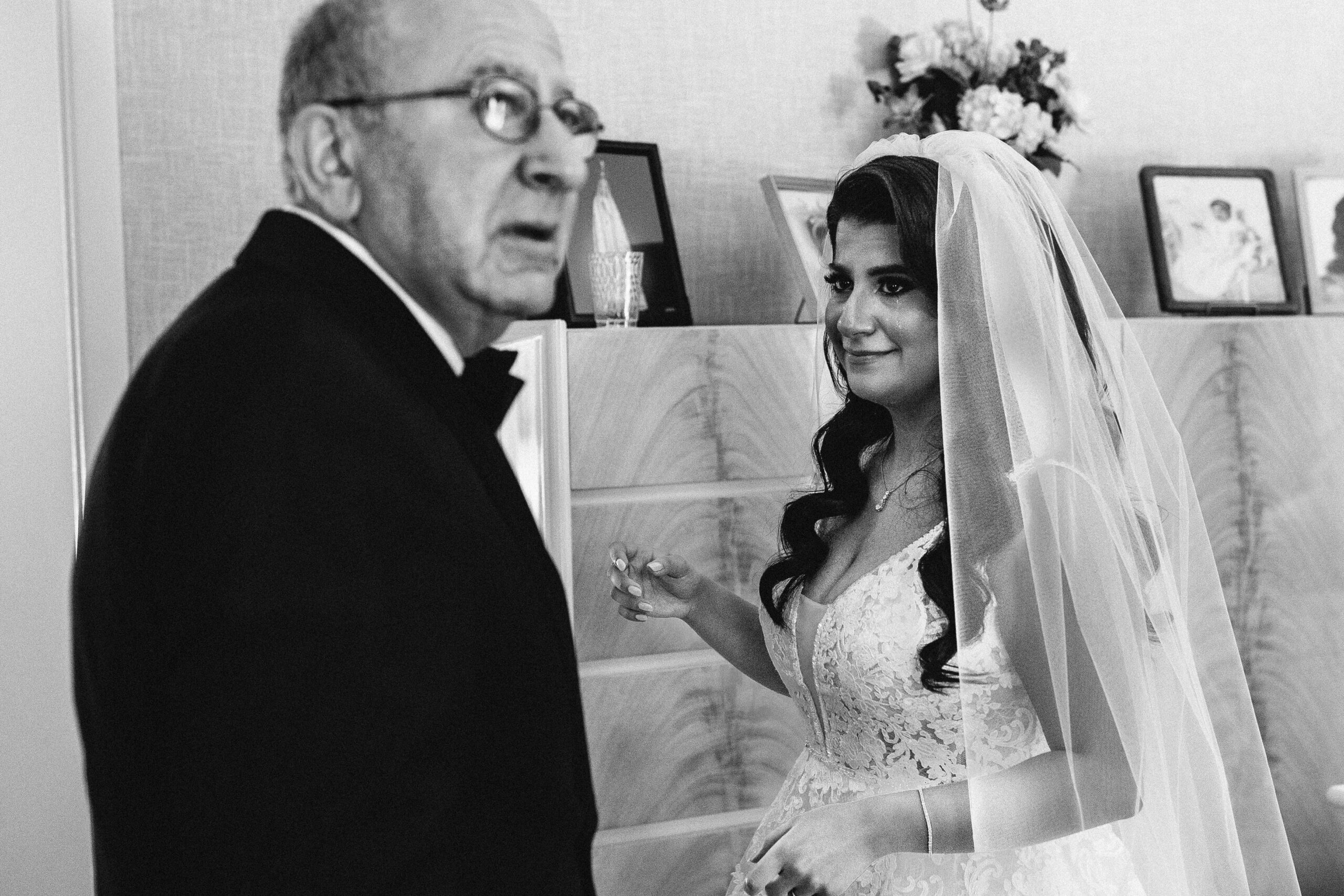 A crying bride, in Farmington Hills, as her father sees her for the first time on her wedding day.