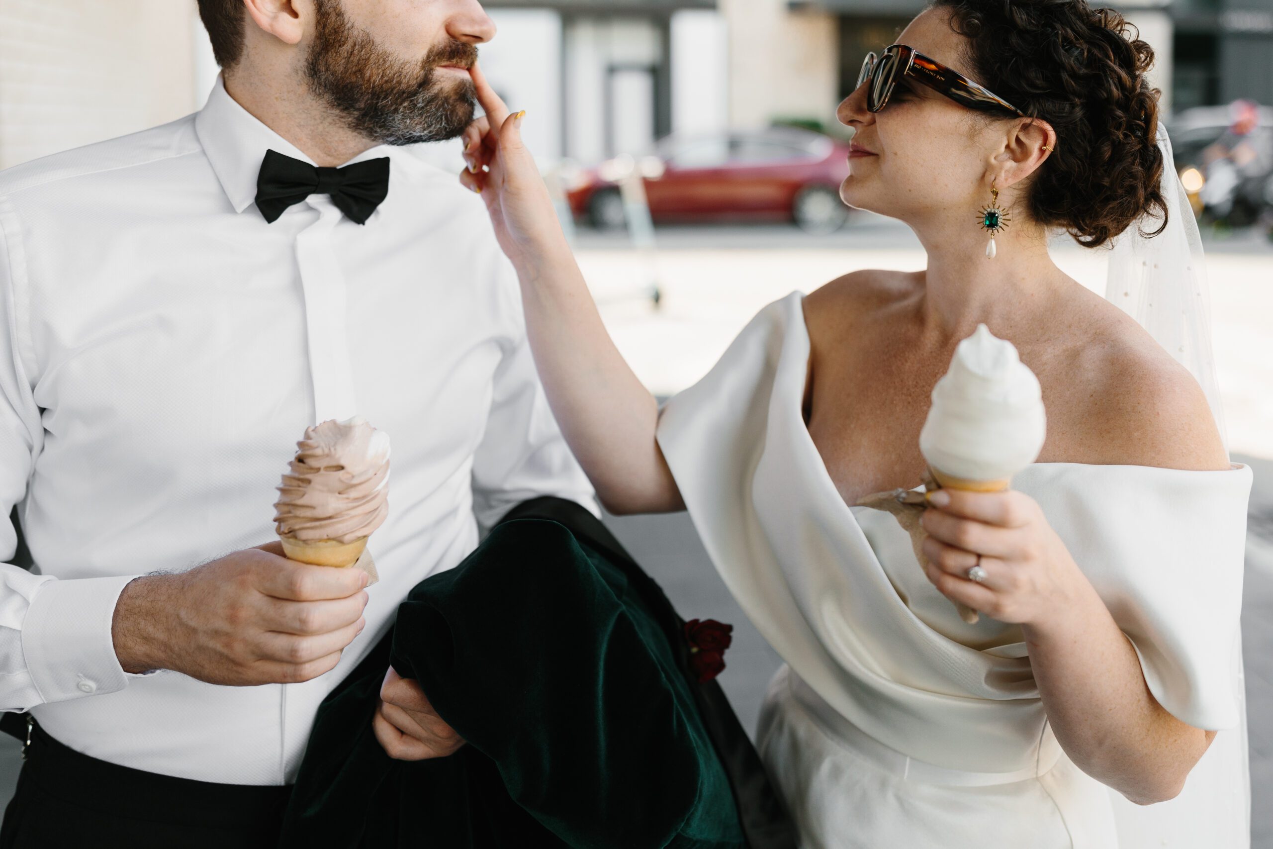 Best Detroit Wedding Photographer image of bride and groom sharing ice cream