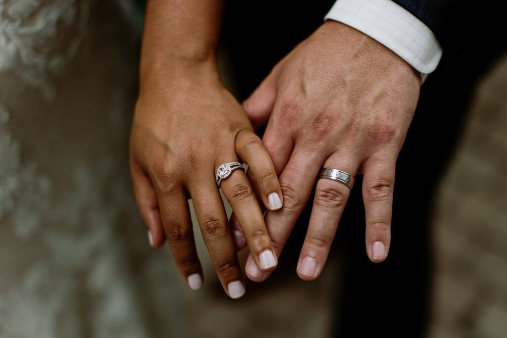 wedding rings and hands at wedding